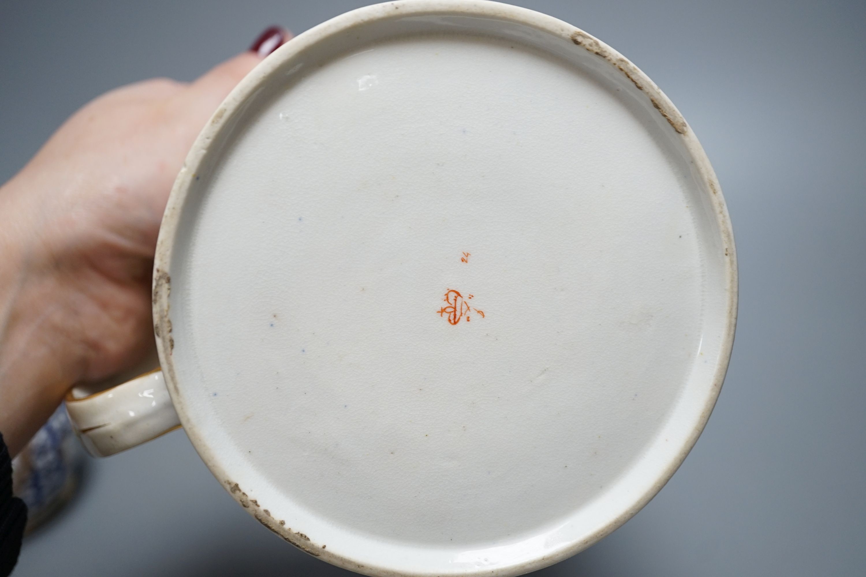 An early 19th century Derby porter mug, 13cm high, a Derby dish and a Chantilly-style sugar sifter